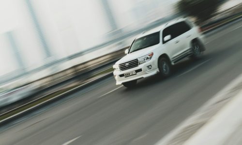 time lapse photography of white sport utility vehicle