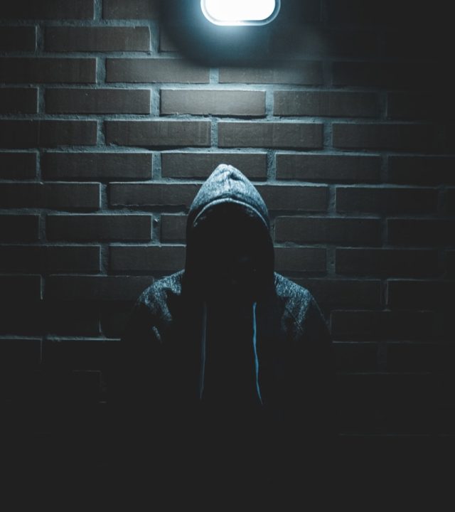 Photo by Luis Villasmil men's black pullover hoodie